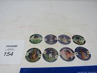 Photo showing all 8 baseball collectible coins arranged in two rows including Jose Canseco and Tony Gwynn coins.