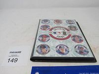Front cover of the MLB Collector Coins binder showing multiple player coins arranged in circular fashion.