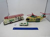 Front view of Hess firetruck, helicopter, and car, showcasing size and design