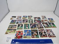 Full layout of 22 Philadelphia Phillies baseball cards spread on white background with ruler for scale