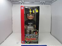 Photo of the talking Hank Williams Steelers doll in original box, front view showing helmet, jersey number 01, and Steelers logo.
