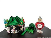 Full lot showing fabric bingo dabber holder with six bingo dabbers, green chip bag with chips, green chip wand, and heart-shaped Betty Boop clock.