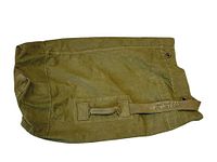 Top view of olive green canvas U.S. Army duffle bag showing fabric handles and strap with metal grommets on end.