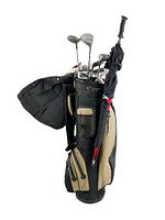 Front-left view of the golf bag showing multiple golf clubs and attached umbrella.