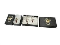 Set including one fairy pendant necklace and one pair of fairy earrings with amber beads, displayed in original Stones 'N Bones branded boxes.