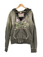 Front view of green True Religion Rat Fink zip up hoodie sweatshirt with graphic on front and full zipper.