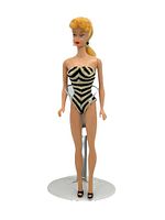 Front view of Barbie on stand