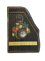 Full view of 60 string zither lap harp guitar with hand-painted floral artwork and sound hole labeled 'Jubel Tone'. Shows overall shape and string layout.