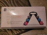 iGym Dumbbell Multi-Combo Set box showing 6 pairs of dumbbells and foldable base stand