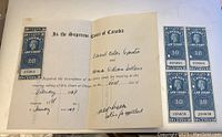 Open Supreme Court Canada legal document from 1949 with blue 10 cent law stamps affixed on both pages