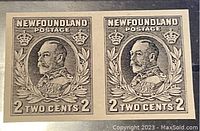 Front view of two adjacent black proof stamps featuring King George V from Newfoundland, Canada, with detailed design elements.