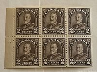 Front view of the pane of 6 brown Canadian postage stamps featuring King George VI, showing detailed portrait and denomination.