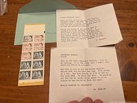 Photo showing accompanying dealer paperwork dated to the late 1900s describing the rarity and errors of the Centenary stamp booklet.