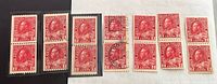 Seven Canadian red 2-cent King George V stamps arranged side by side showing different variations, some in pairs.