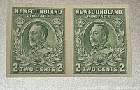 Front face of two green Newfoundland 2-cent proof stamps, connected pair, detailed portrait of King George V, value 2 cents each.