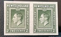 Front view of two green Newfoundland 2 cent postage stamps side by side, imperforate and ungummed, featuring King George VI profile.