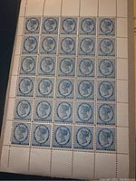 Front view showing full sheet of 40 blue stamps with Queen Victoria profile and 'THREE PENCE' denomination.