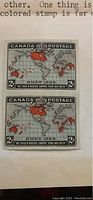 Front of imperforate pair showing map design, red British Empire areas, “X-MAS 1898” legend and denomination in each corner