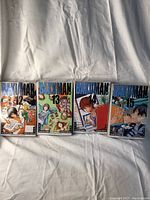 Four Bakuman comic books volumes 12 to 15 laid out on a white surface, showing front cover artwork.