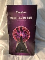 Theefun Magic Plasma Ball packaging box showing brand, product name, model number NX-PS-6, with purple background and image of the plasma ball.