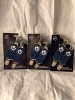 Three sets of two NHL Toronto Maple Leafs glove clips on original backing cards, showing all six clips.