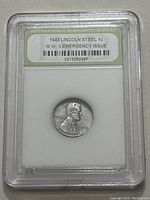 Obverse side of 1943 Lincoln Steel Penny showing the bust of Abraham Lincoln and label in plastic holder