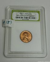 Front side of 1958-P Lincoln penny in slab showing Lincoln's profile and year 1958.