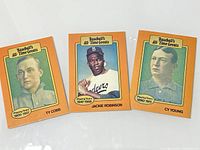 Photo showing three Baseballs All-Time Greats cards featuring Ty Cobb, Jackie Robinson, and Cy Young aligned side by side on a white surface.
