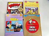 Four Dick Tracy and related comic books by Dragon Lady Press laid out on white background showing front covers