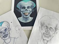 Three artworks: two pencil sketches of alien or fantasy creatures and one colored print featuring a similar creature with large head and prominent teeth.