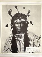 Close-up of a restored black and white photograph depicting Kicking Bear, a Sioux Native American chief with traditional headdress and attire.