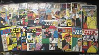 Set of Dick Tracy comic books laid out flat, showing colorful front covers with title and artwork.