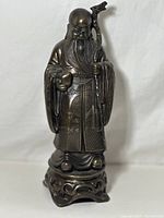 Front view of the Shoushan Stone Peach Fairy figurine on a carved base, showing detailed robe patterns and the peach in hand.