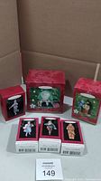 Full collection of Hallmark Keepsake The Wizard of Oz ornaments with original boxes including The Great Oz scene, Dorothy and Toto, Scarecrow, Cowardly Lion, and Poppyfield themed ornaments.