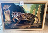 Photo of the full framed painting showing the tiger walking and the monkey perched on a classical column, set outdoors with greenery and stone structures.