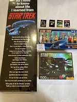 Photo showing Star Trek poster text and image, four magnets, boxed Star Trek collector series figurines, and 1500-piece puzzle