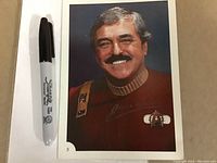 Front of oversized trading card showing portrait of James Doohan as Scotty beside a marker for scale.