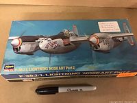 Top view of the box showing the P-38J/L Lightning nose art aircraft illustration and condition of the sealed box.