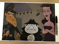 Photo of a colorful cartoon art print showing the three characters Boris, Natasha, and Fearless Leader from a classic animated series.