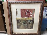 Full view of framed floral print artwork showing frame and artwork in entirety