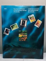 Blue folder cover of the 1991 Souvenir Collection of the Postage Stamps of Canada featuring various stamp images.