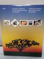 Front cover of 1992 Canadian Souvenir Collection album showing five postage stamp images and sunset background.