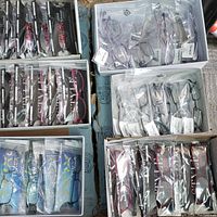 Multiple boxes containing 60 packaged Timex eyewear frames of various styles and colors including titanium models