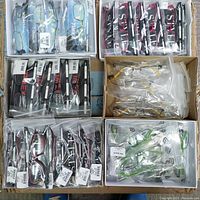 Six boxes of individually sealed Timex frames arranged on cardboard surface