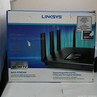 Front of original retail box showing model name, branding, warranty sticker and certification labels