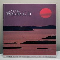 Photo of the front cover of the 'Our World' stamp collector album showing a sunset scene with red sun and silhouetted land masses.