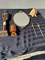 All six items displayed on striped black cloth under sunlight