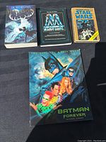 All four books shown together including Batman Forever, Mario Bros, Star Wars, and Harry Potter