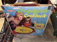 Original Coleco Crokinole game box with retro 1970s style graphics showing players and branding.