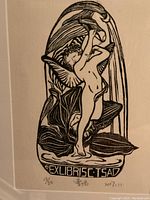 Close-up image showing details of the lithograph including the figure, numbering (13/50), artist signature, and date (2017).